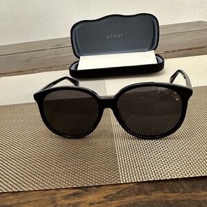 Gucci Glossy Black Round Frame Sunglasses